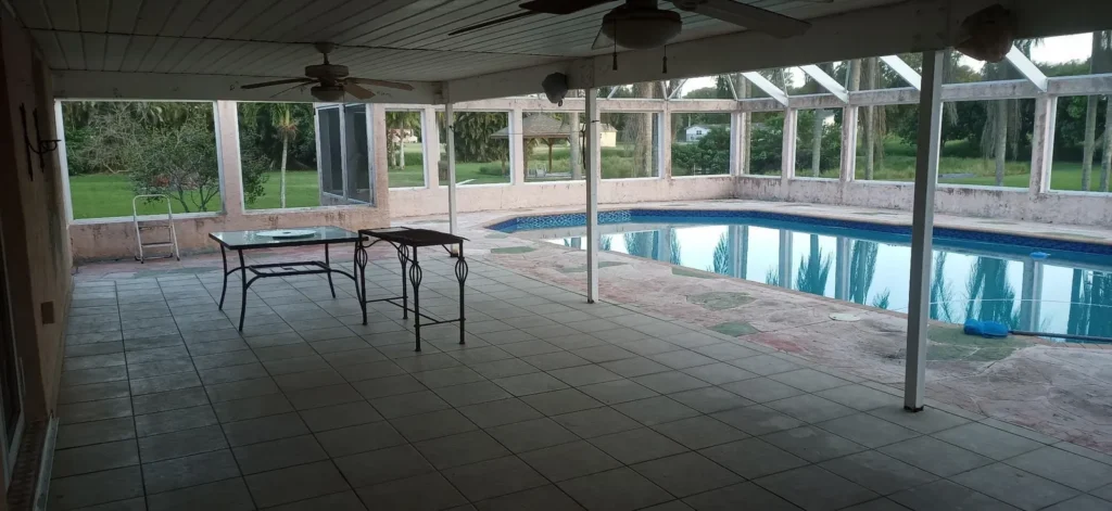 Covered pool patio in Pembroke Pines, FL before enclosing it with impact glass