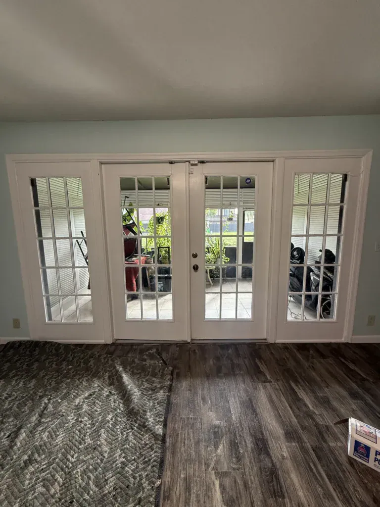 White French doors with grids and matching sidelites, interior view